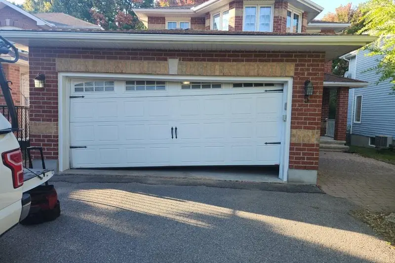 DPS Garage Doors emergency repair of an off-track jammed double garage door in Ottawa