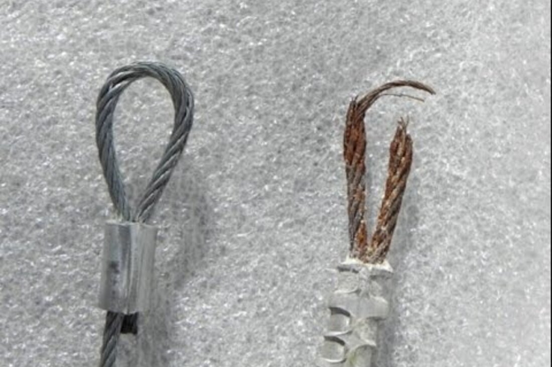 DPS Garage Doors comparison of a new garage door lifting cable beside a frayed snapped cable being replaced in Ottawa