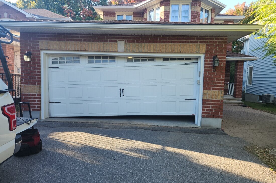 DPS Garage Doors emergency repair of an off-track jammed double garage door in Ottawa