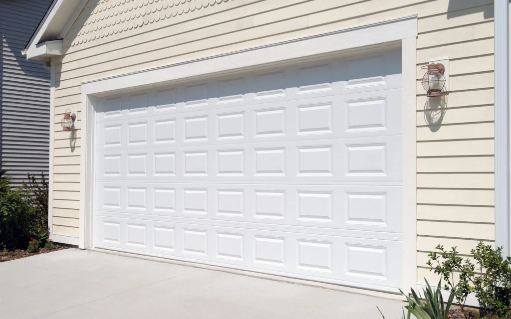 Classic short raised-panel insulated garage door on a Ottawa home