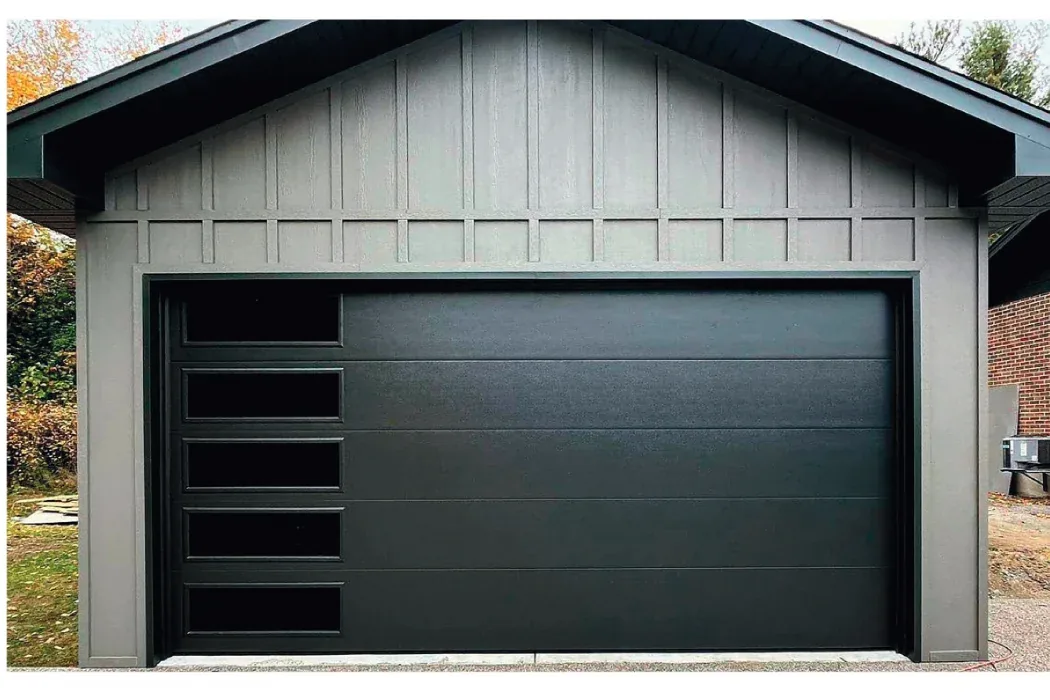 Modern flush flat-panel garage door with horizontal slit windows